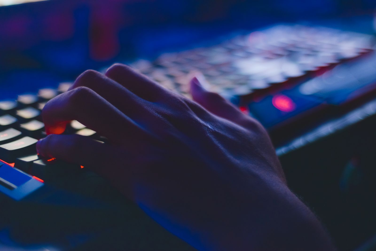 Person typing on a laptop keyboard, quickly inserting a saved prompt into ChatGPT