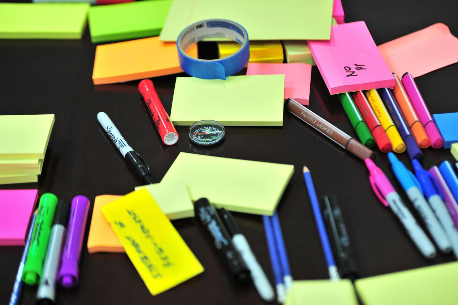 Scattered sticky notes representing disorganized ChatGPT prompts stored in many places